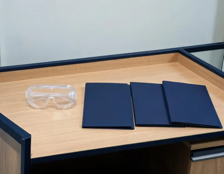 Bulk safety goggles brief beside factory quote folders